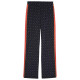 Puma Γυναικείο παντελόνι φόρμας Road to Unity Straight Printed T7 Track Pants